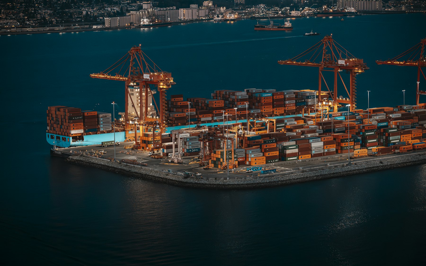 Container terminal with cranes at night